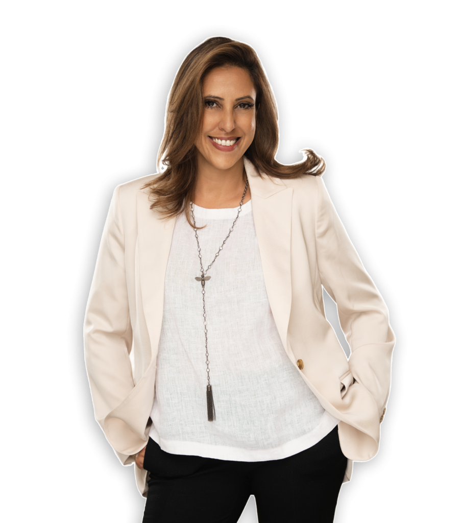 Talia Wagner in a beige blazer and white blouse, smiling confidently.